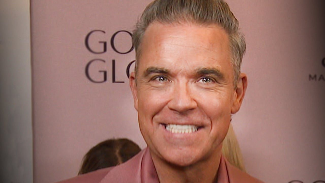 Robbie Williams Shows Off ‘Brand-New Teeth’ He Got Ahead of 2025 Golden Globes (Exclusive)