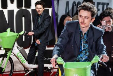 Timothée Chalamet Rides Bike Onto Red Carpet Premiere for Bob Dylan Biopic